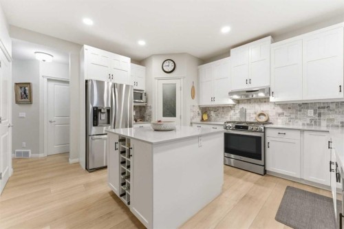 74 Evercreek Bluffs Road Sw, Calgary, AB - Indoor Photo Showing Kitchen With Upgraded Kitchen