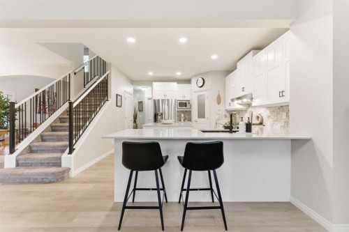 74 Evercreek Bluffs Road Sw, Calgary, AB - Indoor Photo Showing Kitchen With Upgraded Kitchen