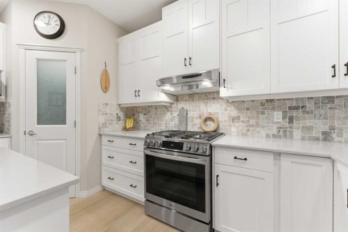 74 Evercreek Bluffs Road Sw, Calgary, AB - Indoor Photo Showing Kitchen With Upgraded Kitchen