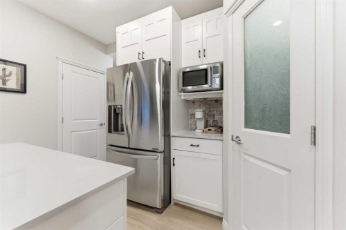 74 Evercreek Bluffs Road Sw, Calgary, AB - Indoor Photo Showing Kitchen