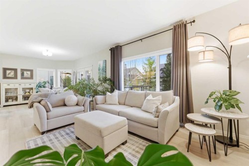 74 Evercreek Bluffs Road Sw, Calgary, AB - Indoor Photo Showing Living Room