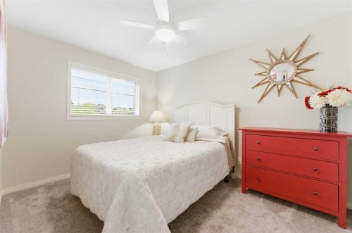 74 Evercreek Bluffs Road Sw, Calgary, AB - Indoor Photo Showing Bedroom