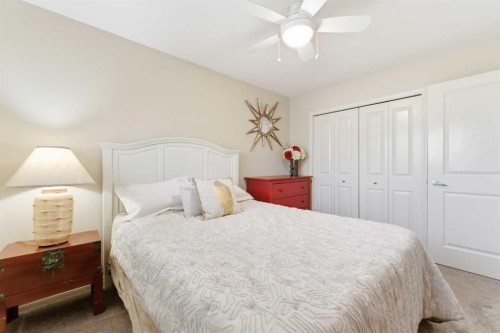 74 Evercreek Bluffs Road Sw, Calgary, AB - Indoor Photo Showing Bedroom