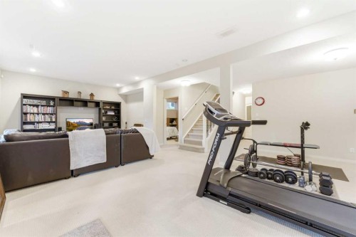 74 Evercreek Bluffs Road Sw, Calgary, AB - Indoor Photo Showing Gym Room