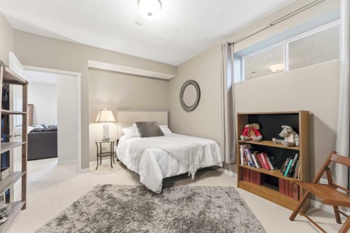 74 Evercreek Bluffs Road Sw, Calgary, AB - Indoor Photo Showing Bedroom