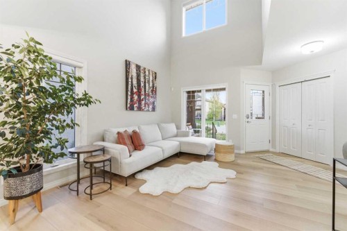 74 Evercreek Bluffs Road Sw, Calgary, AB - Indoor Photo Showing Living Room