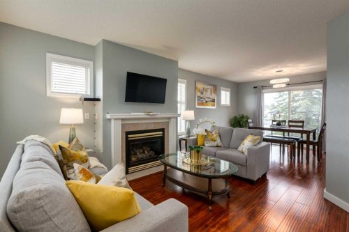 126 Harvest Gold Place Ne, Calgary, AB - Indoor Photo Showing Living Room With Fireplace