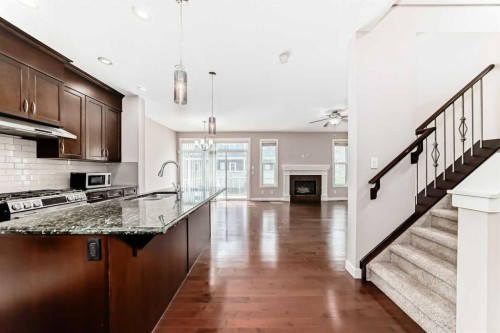 101 Redstone Drive Ne, Calgary, AB - Indoor Photo Showing Kitchen With Fireplace With Upgraded Kitchen