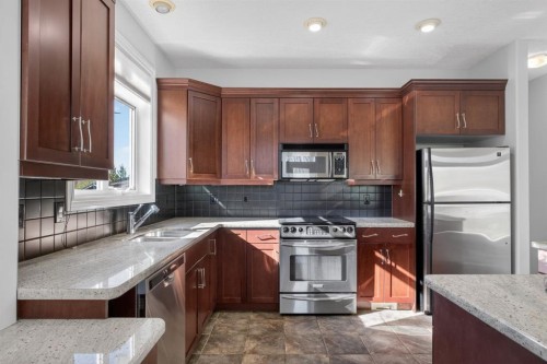 14 Discovery Woods Villas Sw, Calgary, AB - Indoor Photo Showing Kitchen With Double Sink