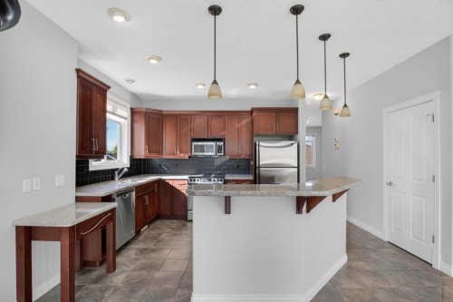14 Discovery Woods Villas Sw, Calgary, AB - Indoor Photo Showing Kitchen With Double Sink With Upgraded Kitchen