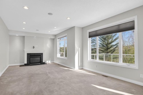 14 Discovery Woods Villas Sw, Calgary, AB - Indoor Photo Showing Living Room With Fireplace