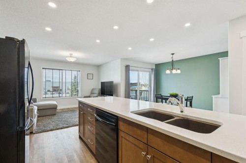 231 Kingsbridge Road Se, Airdrie, AB - Indoor Photo Showing Kitchen With Double Sink