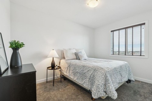 231 Kingsbridge Road Se, Airdrie, AB - Indoor Photo Showing Bedroom