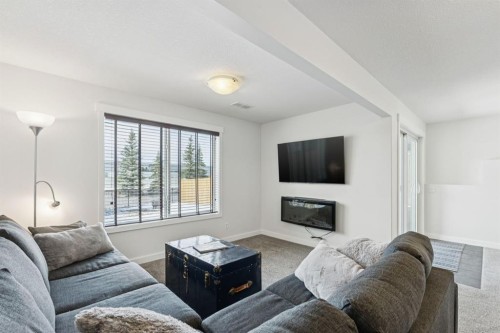 231 Kingsbridge Road Se, Airdrie, AB - Indoor Photo Showing Living Room With Fireplace
