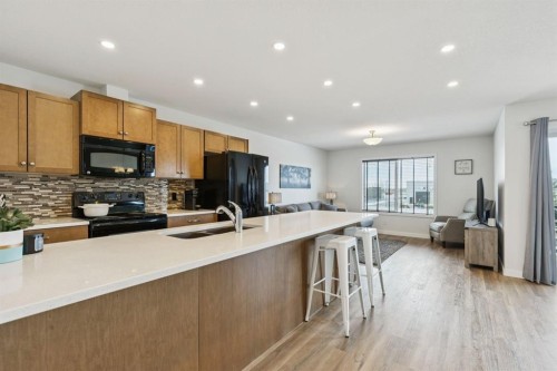 231 Kingsbridge Road Se, Airdrie, AB - Indoor Photo Showing Kitchen With Double Sink With Upgraded Kitchen