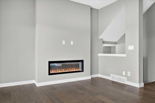 156 Crimson Ridge Place Nw, Calgary, AB - Indoor Photo Showing Other Room With Fireplace