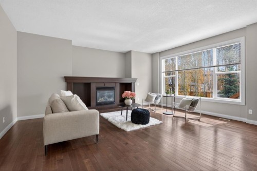 94 Evansdale Common Nw, Calgary, AB - Indoor Photo Showing Living Room With Fireplace