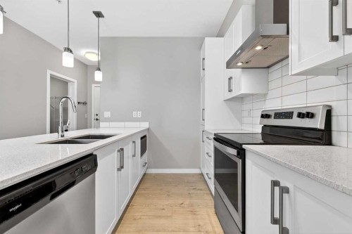 403-122 Mahogany Centre Se, Calgary, AB - Indoor Photo Showing Kitchen With Stainless Steel Kitchen With Double Sink With Upgraded Kitchen