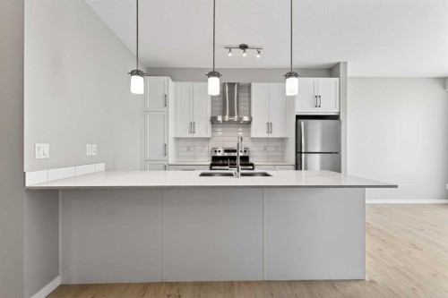 403-122 Mahogany Centre Se, Calgary, AB - Indoor Photo Showing Kitchen With Stainless Steel Kitchen With Upgraded Kitchen