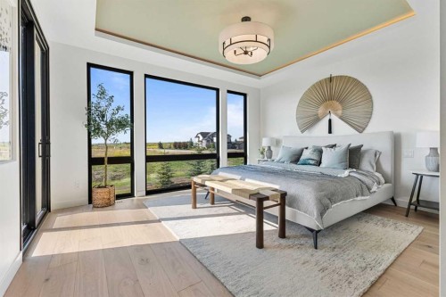 8 Monterra Rise, Cochrane Lake, AB - Indoor Photo Showing Bedroom