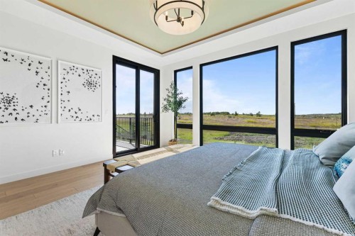 8 Monterra Rise, Cochrane Lake, AB - Indoor Photo Showing Bedroom