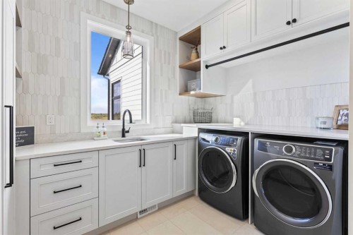 8 Monterra Rise, Cochrane Lake, AB - Indoor Photo Showing Laundry Room