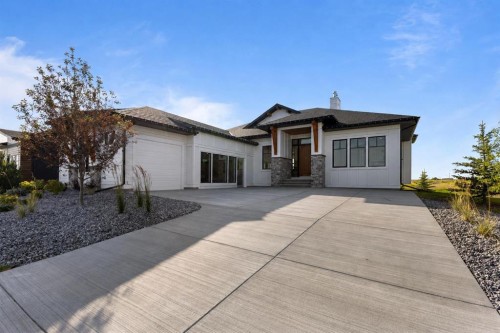 8 Monterra Rise, Cochrane Lake, AB - Outdoor With Facade