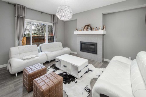 85 Legacy Glen View Se, Calgary, AB - Indoor Photo Showing Living Room With Fireplace