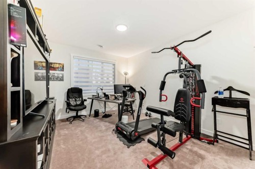 7 Wolf Crescent, Okotoks, AB - Indoor Photo Showing Gym Room