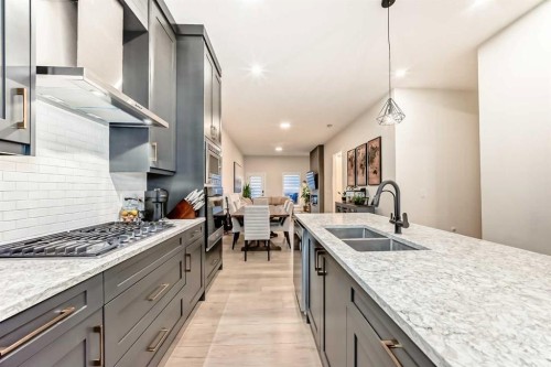7 Wolf Crescent, Okotoks, AB - Indoor Photo Showing Kitchen With Double Sink With Upgraded Kitchen
