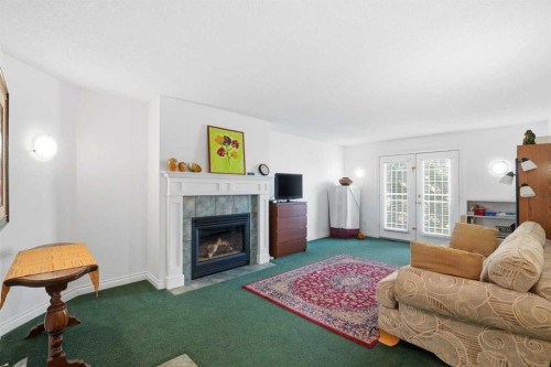 18 Varsity Estates Park Nw, Calgary, AB - Indoor Photo Showing Living Room With Fireplace