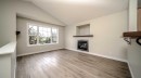 367 Copperfield Heights Se, Calgary, AB  - Indoor Photo Showing Living Room With Fireplace 