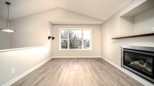 367 Copperfield Heights Se, Calgary, AB - Indoor Photo Showing Living Room With Fireplace