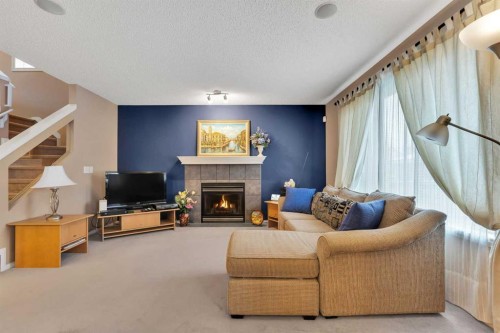 15 Saddletree Drive Ne, Calgary, AB - Indoor Photo Showing Other Room With Fireplace