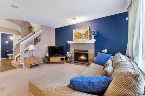 15 Saddletree Drive Ne, Calgary, AB - Indoor Photo Showing Living Room With Fireplace