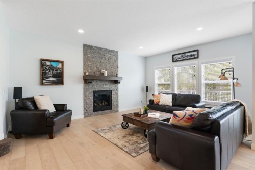 99 Ridge View Close, Cochrane, AB - Indoor Photo Showing Living Room With Fireplace