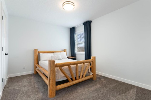 99 Ridge View Close, Cochrane, AB - Indoor Photo Showing Bedroom
