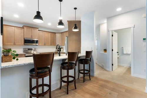 99 Ridge View Close, Cochrane, AB - Indoor Photo Showing Kitchen With Upgraded Kitchen