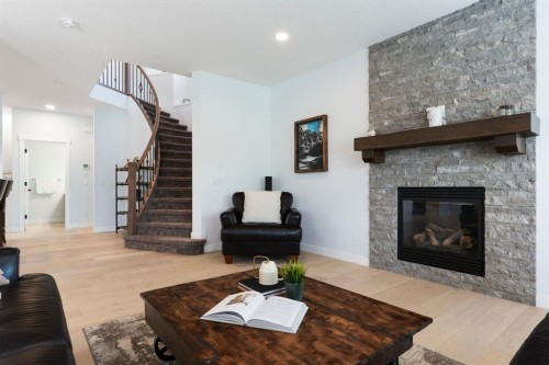 99 Ridge View Close, Cochrane, AB - Indoor Photo Showing Living Room With Fireplace