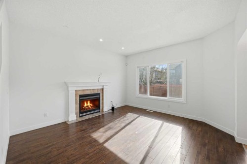 88 Saddletree Close Ne, Calgary, AB - Indoor Photo Showing Living Room With Fireplace