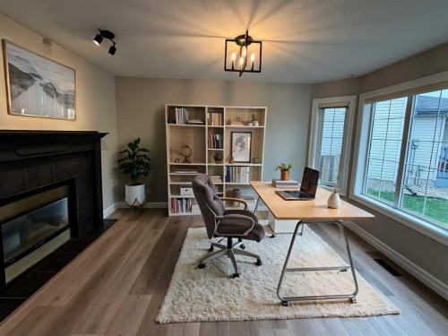 32 Carriere Crescent, Beaumont, AB - Indoor Photo Showing Other Room With Fireplace
