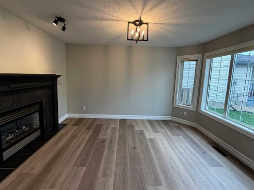 32 Carriere Crescent, Beaumont, AB - Indoor With Fireplace