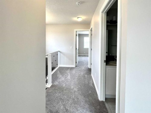 30 Emberside Link, Cochrane, AB - Indoor Photo Showing Other Room