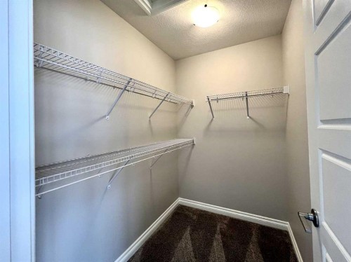30 Emberside Link, Cochrane, AB - Indoor With Storage