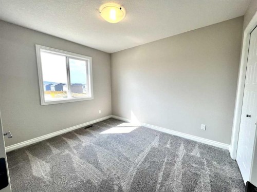 30 Emberside Link, Cochrane, AB - Indoor Photo Showing Other Room