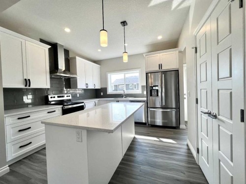 30 Emberside Link, Cochrane, AB - Indoor Photo Showing Kitchen With Upgraded Kitchen