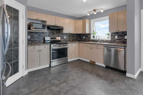111 Arbour Meadows Close Nw, Calgary, AB - Indoor Photo Showing Kitchen With Stainless Steel Kitchen With Double Sink