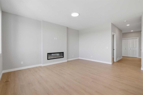 139 Belvedere Crescent Se, Calgary, AB - Indoor With Fireplace