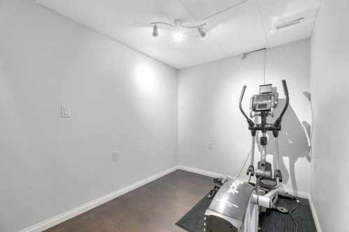 319 Saddlebrook Circle Ne, Calgary, AB - Indoor Photo Showing Gym Room