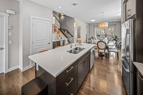 67 Mahogany Row Se, Calgary, AB - Indoor Photo Showing Kitchen With Double Sink With Upgraded Kitchen